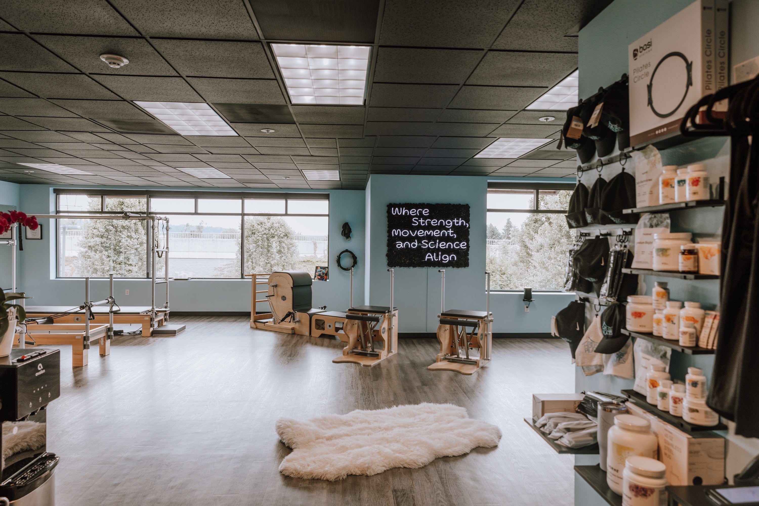 Interior of a fitness studio with equipment and retail space