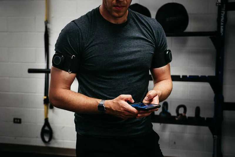 Saga Fitness - a guy using his iphone